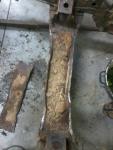 dirt filled bent cross member
